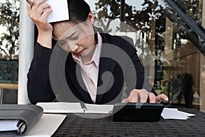 woman calculate domestic bills at home. Businesswoman using calculator at modern office. Young female checking balance & costs.