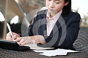 woman calculate domestic bills at home. Businesswoman using calculator at office. Young female checking balance & costs. Startup