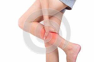 Woman with calf feeling pain on white background.