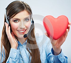 Woman call center operator hold love symbol Red heart. Close up