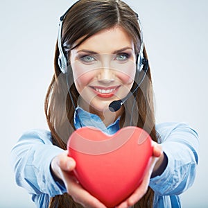 Woman call center operator hold love symbol Red heart. Close up