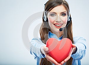 Woman call center operator hold love symbol Red heart. Close up