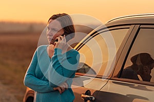 Woman calling for assistance and help on the road