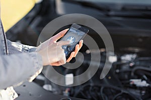 Woman calling a car assistance service