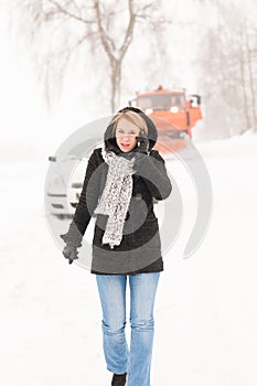 Woman calling for help broken car snow