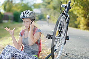Woman calling for help after having bicycle accident