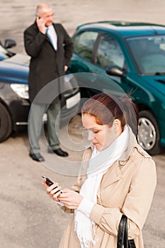 Woman calling insurance after car accident crash