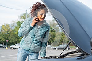 Woman calling mechanic service after vehicle problem