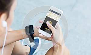 Woman Calling Ordering Taxi Via Smartphone Sitting Outdoors, Cropped