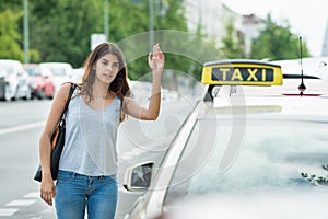 Woman Calling For Taxi On Street