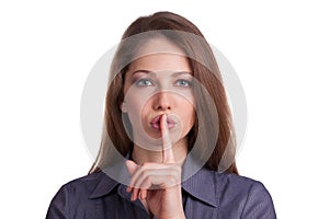 Woman calls for silence, finger on lips