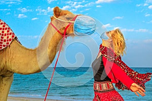 Woman with camel at Covid-19