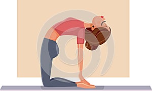 Woman in Camel Pose Doing Yoga on a Mat