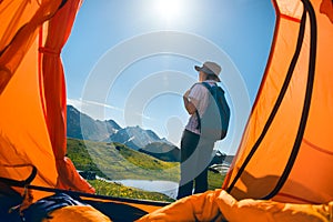 Woman camping in mountains