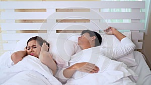 Woman can not sleep while man snoring