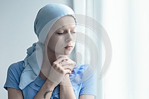 Woman with cancer praying