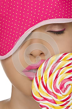 Woman with candy in his mouth and blindfold