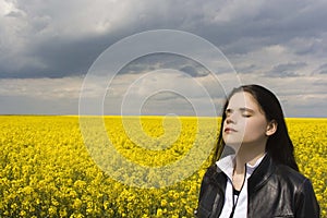 Woman on canola field