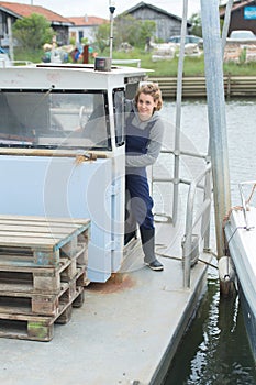 woman captain arriving to harbor photo