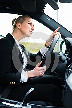 Woman in car being angry cursing other driver photo