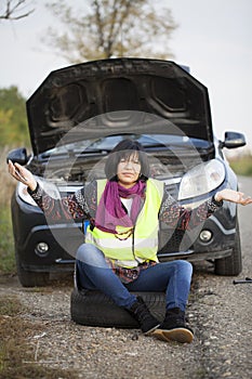 Woman car broke down on the empty road