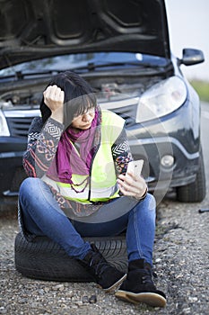 Woman car broke down on the empty road