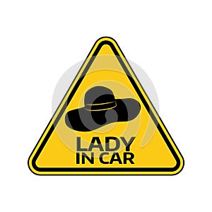 Woman car driver sticker. Female in automobile warning sign. Lady hat in yellow triangle to a vehicle glass.