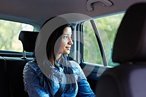 Woman in a car looking out the window