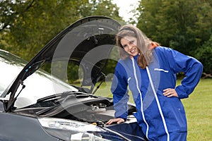 Woman car mechanic in action