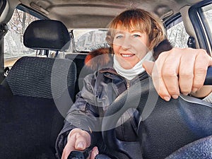 Woman in a Car Taking a Selfie