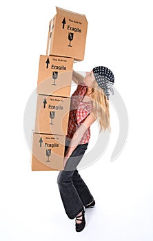 Woman with cardboard boxes ready to fall
