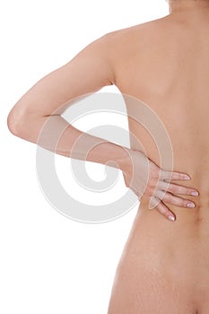 Woman caressing her bare shoulder and back