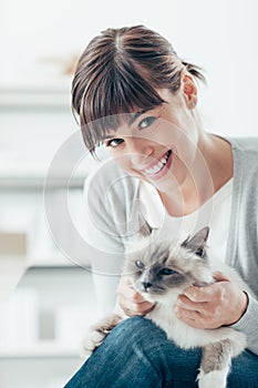 Woman caressing her birman cat