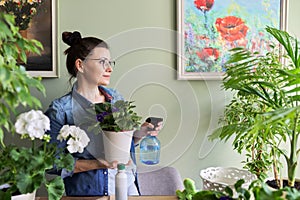 Woman caring for indoor plants, hobbies and leisure, nature in the house