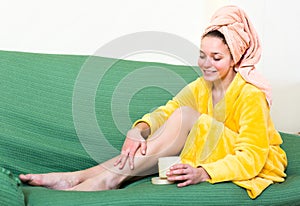 Woman caring for skin on legs