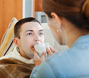 Woman caring for unwell husband