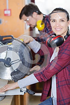 Woman carpenter looking at camera