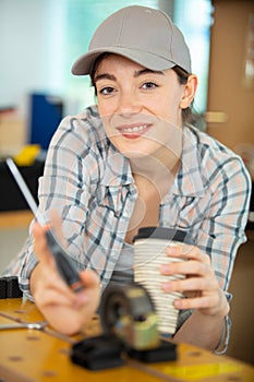 woman carpenter standing in workshop