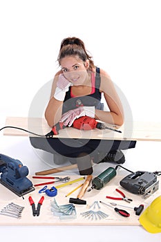 Woman carpenter with work tools