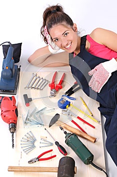 Woman carpenter with work tools