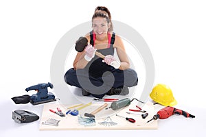 Woman carpenter with work tools