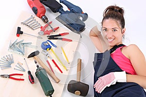 Woman carpenter with work tools