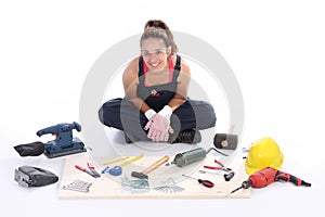 Woman carpenter with work tools