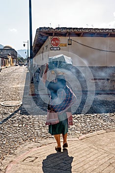 Woman carries a basket on her head - Antigua - Guatemala