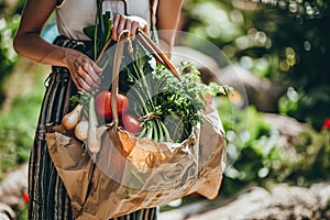 woman carries paper grocery bag full of vegetables