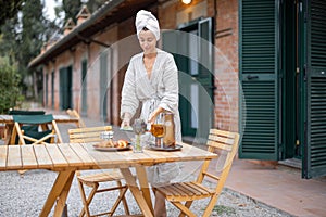 Woman carry food to table for breakfast at morning