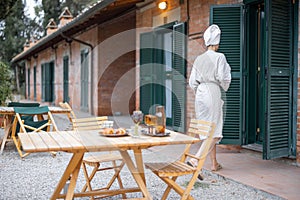 Woman carry food to table for breakfast at morning