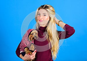 Woman carry yorkshire terrier. Girl attractive blonde hug cute dog. Apparel and accessories. Pet supplies. Dressing your