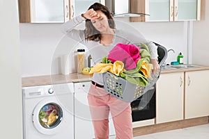 Woman Carrying Basket With Clothes