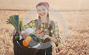 Woman carrying basket with healthy and locally produced vegetables